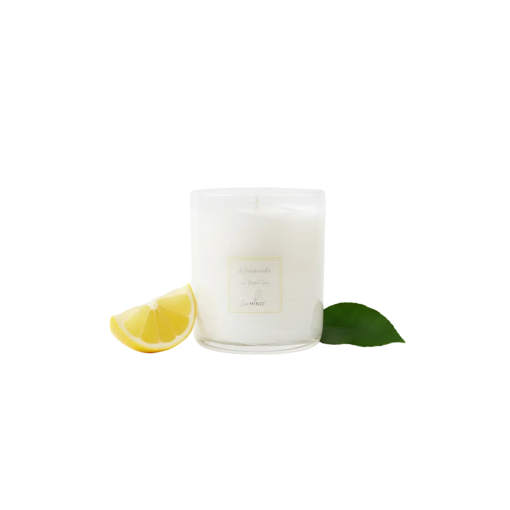 Candle jar with lemon on pure white